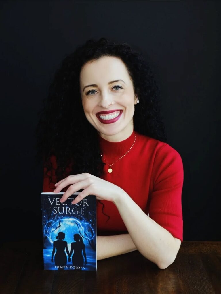 Diana Dzioba is a Canadian writer and proud member of the LGBTQIA+ community, debuting her first novel, Vector Surge (2026)—a sci-fi LGBTQIA+ romance about what it means to rebuild your world, your heart, and your sense of belonging. 💖